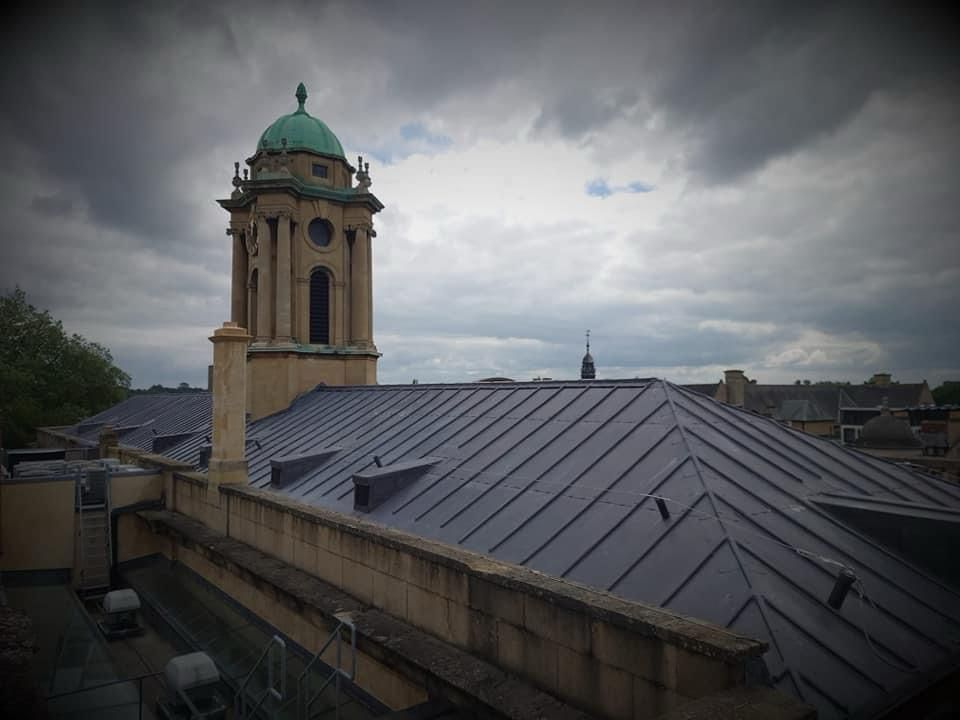 A roof, which has had quality lead work done on it. The building looks to be from the 1800's.